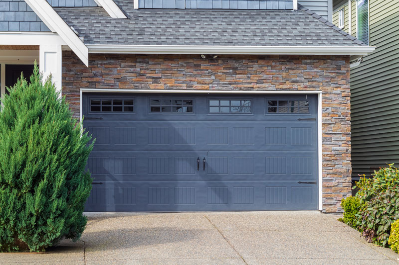 blue-Garage-door-with-windows Blue insulated metal garage door.